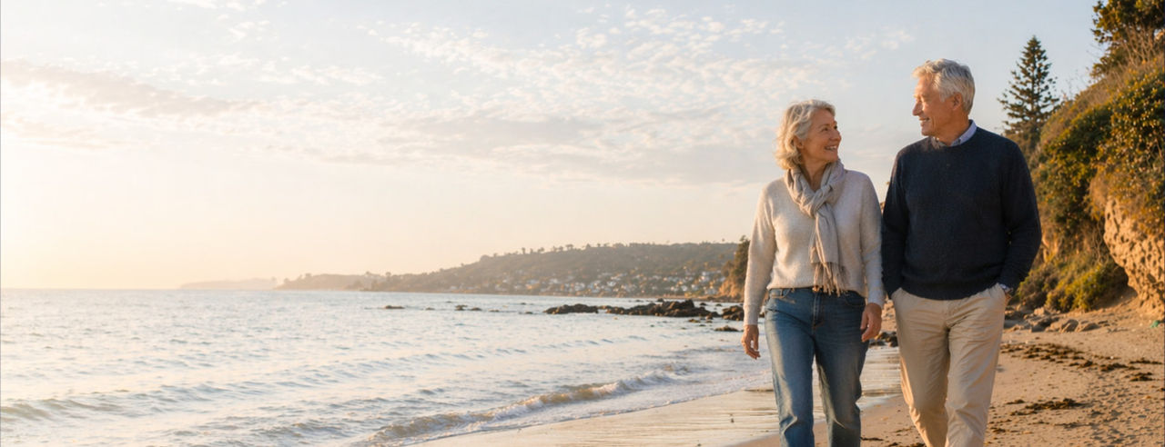 Mature couple walking on beach/outdoors, calm dignified tone